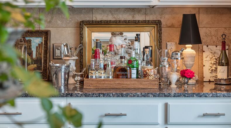 A beautifully styled bar is always at the ready in the kitchen, so guests can help themselves. (Bob Greenspan/TNS)