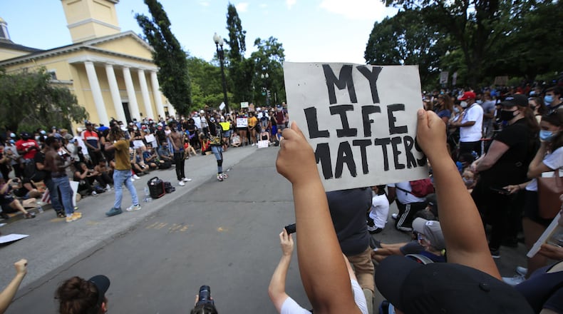 Demonstrators protest Friday, June 5, 2020, near the White House in Washington, over the death of George Floyd, a black man who was in police custody in Minneapolis. Floyd died after being restrained by Minneapolis police officers. (AP Photo/Manuel Balce Ceneta)