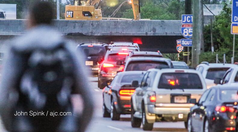 Traffic was building, but still moving along Piedmont Road during Monday morning’s commute. (Photo: JOHN SPINK/jspink@ajc.com)