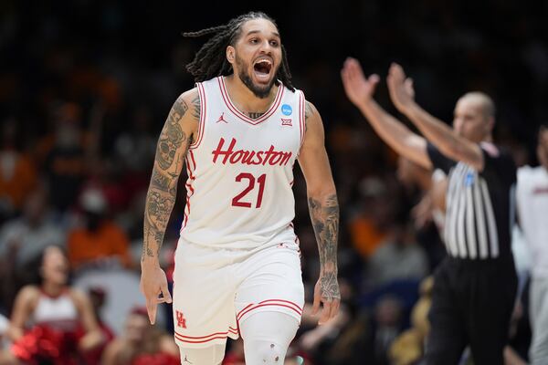 Houston's Emanuel Sharp celebrates during the second half in the Elite Eight round of the NCAA college basketball tournament against Tennessee Sunday, March 30, 2025, in Indianapolis. (AP Photo/Michael Conroy)