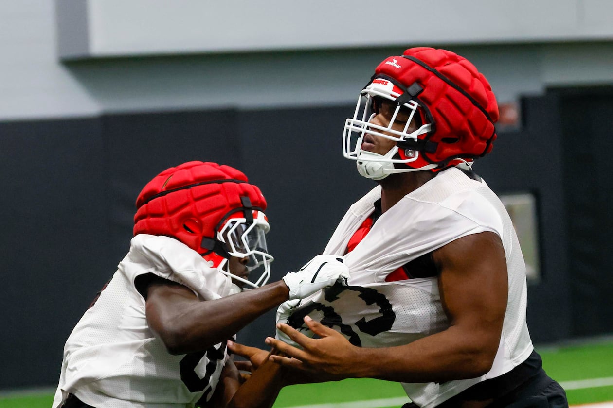 Georgia linebacker PJ Dean (right) is pulled out during their first football practice at the University of Georgia practice facility, Wednesday, August 5, 2026, in Athens, Ga. (Miguel Martinez/AJC)