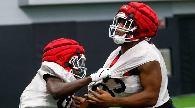 Georgia linebacker PJ Dean (right) is pulled out during their first football practice at the University of Georgia practice facility, Wednesday, August 5, 2026, in Athens, Ga. (Miguel Martinez/AJC)