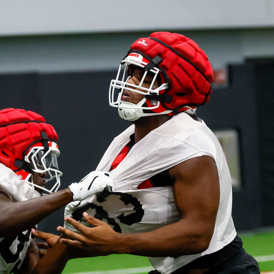 Georgia linebacker PJ Dean (right) is pulled out during their first football practice at the University of Georgia practice facility, Wednesday, August 5, 2026, in Athens, Ga. (Miguel Martinez/AJC)