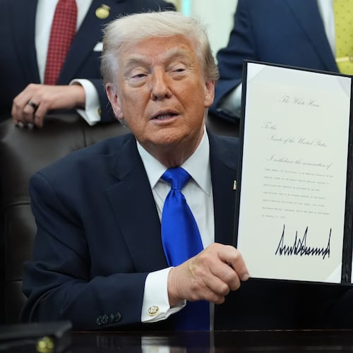 President Donald Trump signs documents regarding the withdrawal of the current nomination and nomination of a new surgeon general in the Oval Office of the White House, Thursday, April 30, 2026, in Washington. (AP Photo/Alex Brandon)