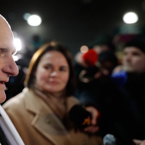 Nobel Peace Prize laureate Ales Bialiatski, one of released Belarusian prisoners, arrives at the U.S. Embassy in Vilnius, Lithuania, on Saturday, Dec. 13, 2025, as Belarusian opposition leader Sviatlana Tsikhanouskaya, background stands near. (AP Photo/Mindaugas Kulbis)