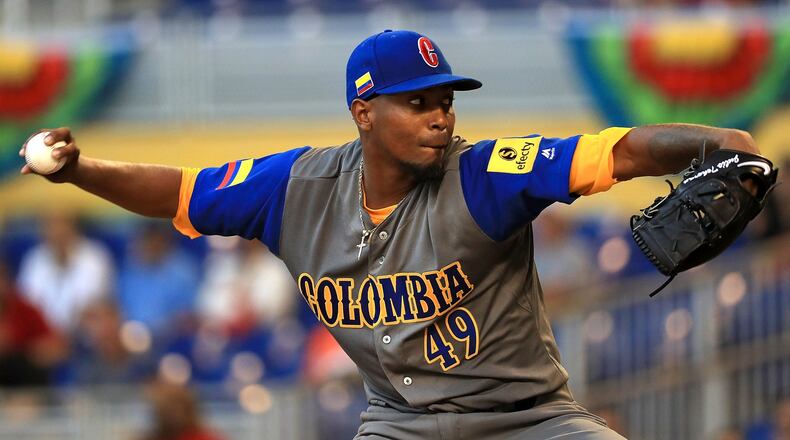 The Braves’ Julio Teheran delivers one of his 61 pitches for Colombia in a winning WBC performance against Canada. (Mike Ehrmann/Getty Images)