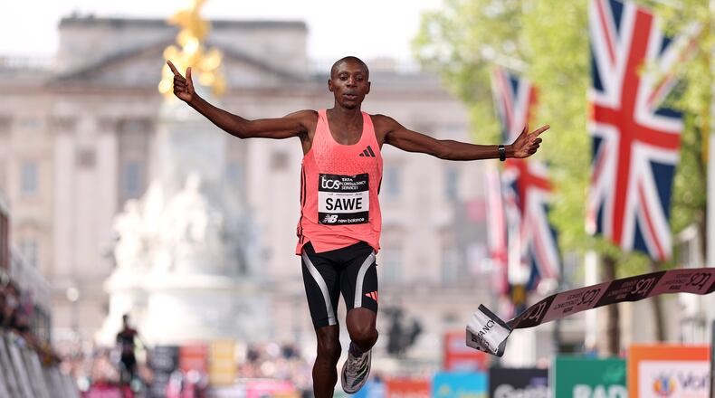 Sebastian Sawe from Kenya crosses the finish line to win the men's race at the London Marathon in London, Sunday, April 26, 2026.(AP Photo/Ian Walton)
