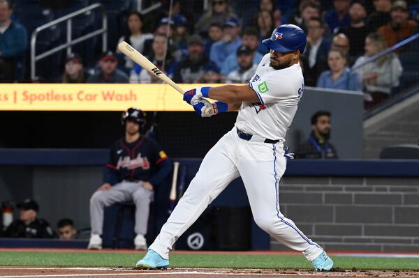 Toronto Blue Jays' Anthony Santander hits a double against the Atlanta Braves in first inning baseball action in Toronto on Wednesday, April 16, 2025. (Jon Blacker/The Canadian Press via AP)