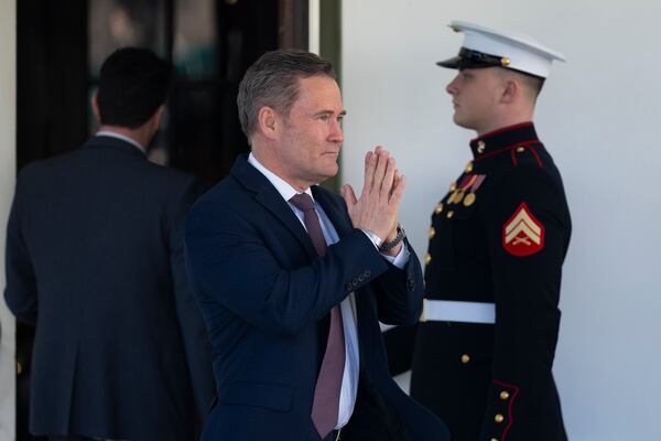 White House national security adviser Mike Waltz gestures to Fox News host and President Donald Trump's daughter-in-law, Lara Trump, after speaking with her at the White House in Washington, Wednesday, March 19, 2025. (AP Photo/Ben Curtis)