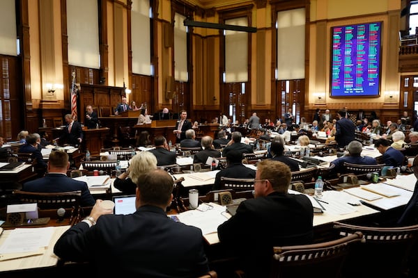 House members cast votes at the Georgia Capitol in Atlanta on  April 2 (Miguel Martinez/AJC)