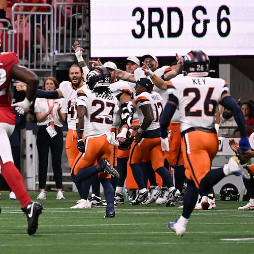 Denver Broncos cornerback Jahdae Barron runs for a touchdown after intercepting the ball during the first half of an NFL preseason game at Mercedes-Benz Stadium on Friday, Aug. 14, 2026, in Atlanta. (Hyosub Shin/AJC)