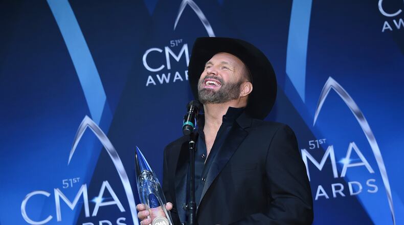 Garth Brooks holds his Entertainer of the Year award backstage at the CMA Awards on Nov. 8, 2017, in Nashville. (Photo by Evan Agostini/Invision/AP)