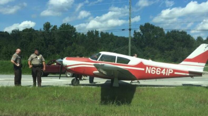 A plane landed on U.S. 441 in Jackson County on Tuesday. (Credit: Channel 2 Action News)