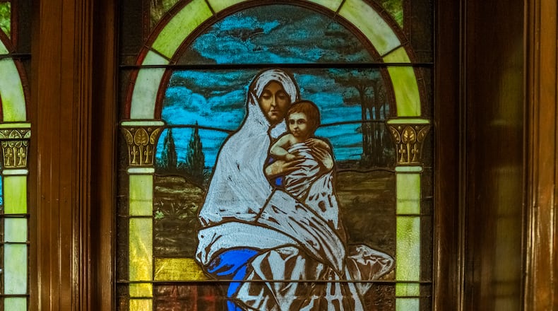 The stained glass window from 1909 that inspired historian David Levering Lewis' new book is located inside of First Congregational Church. The depiction of the Madonna was inspired by Lewis' maternal grandmother. (Ronald Williams/AJC)