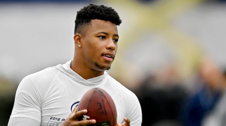 Former Penn State running back Saquon Barkley tosses a ball around during Penn State Pro Day on Tuesday, March 20, 2018, at Holuba Hall in University Park, Pa. (Abby Drey/Centre Daily Times/TNS)
