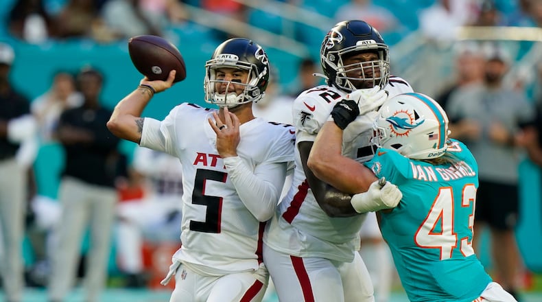 Atlanta Falcons quarterback AJ McCarron (5) looks to pass during the first half of a NFL football game against the Miami Dolphins, Sunday, Dec. 13, 2020, in Miami Gardens, Fla. (AP Photo/Lynne Sladky)