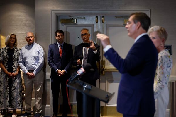 Supporters of Secretary of State Brad Raffensperger watch his speech during the primary election night watch party at the Waverly Hotel on Tuesday. (Miguel Martinez/AJC)