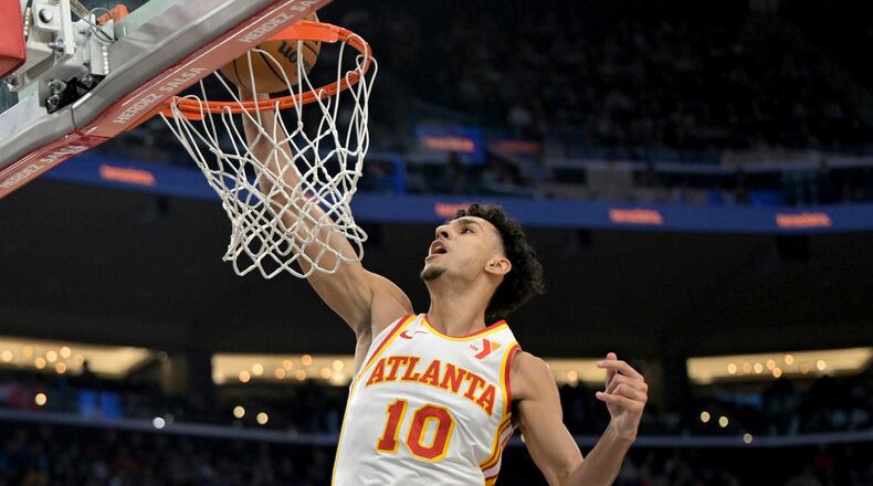 Atlanta Hawks forward Zaccharie Risacher dunks during the first half of an NBA basketball game against the Los Angeles Clippers, Saturday, Jan. 4, 2025, in Los Angeles. (AP Photo/Jayne-Kamin-Oncea)