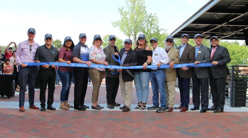 Sugar Hill officials, residents and business leaders gathered on April 23 to dedicate the city’s E Center. (Courtesy City of Sugar Hill)