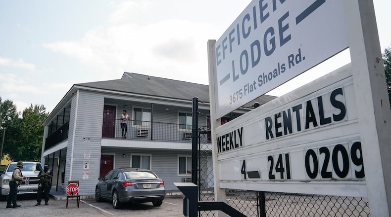 Armed guards are seen on the premises of the Efficiency Lodge on Flat Shoals Road on Wednesday, October 7, 2020, in Panthersville. (Elijah Nouvelage for The Atlanta Journal-Constitution)