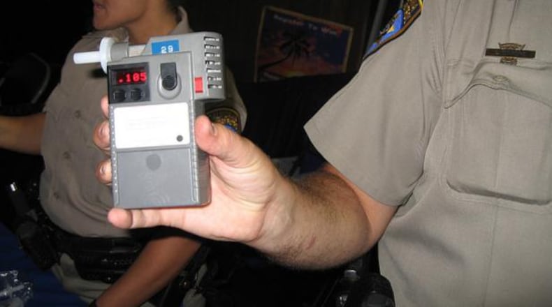 A police officer holds up a Breathalyzer device. New technology, similar to a Breathalyzer, from an Israeli research team makes it possible to analyze a person’s breath to diagnose 17 different diseases, including cancer.