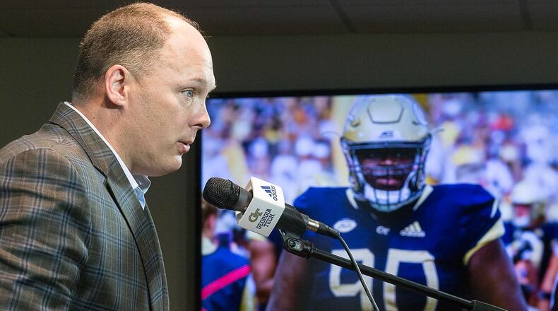 A photo of late Georgia Tech football player Brandon Adams appears on a screen as Tech coach Geoff Collins speaks about Adams at a memorial service at McCamish Pavilion, Monday, March 25, 2019. (ALYSSA POINTER/ALYSSA.POINTER@AJC.COM)