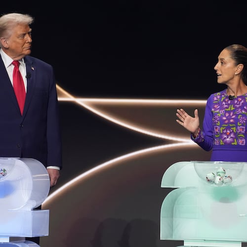 FILE -Mexican President Claudia Sheinbaum, right, speaks as President Donald Trump, left, stands on stage during the draw for the 2026 soccer World Cup at the Kennedy Center in Washington, Dec. 5, 2025. (AP Photo/Evan Vucci, File)