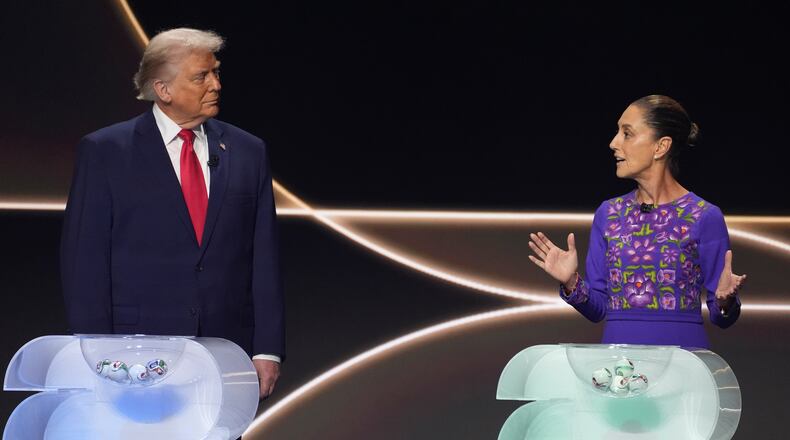 FILE -Mexican President Claudia Sheinbaum, right, speaks as President Donald Trump, left, stands on stage during the draw for the 2026 soccer World Cup at the Kennedy Center in Washington, Dec. 5, 2025. (AP Photo/Evan Vucci, File)