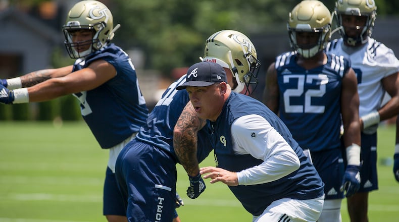 Georgia Tech coach Geoff Collins runs a drill. (Alyssa Pointer/alyssa.pointer@ajc.com)