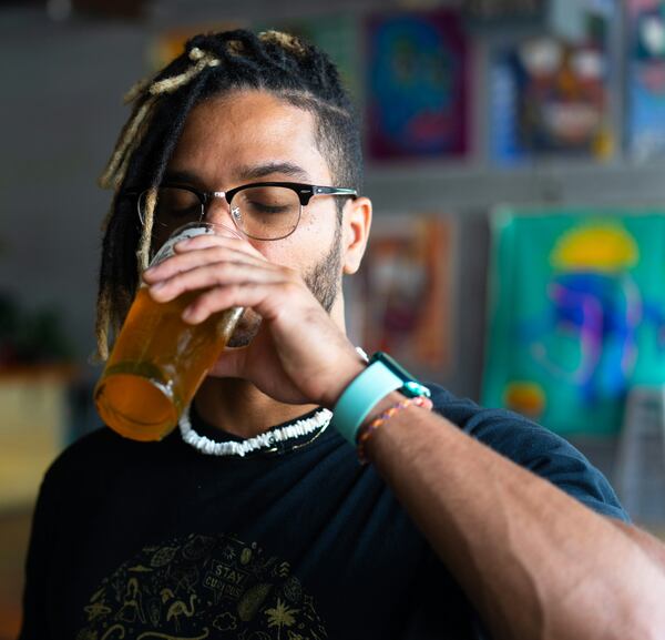 Shakeel Radford, a partner at Atlanta-based Our Culture Brewing Company, takes a sip of Our Culture's Harvest & Bloom beer.