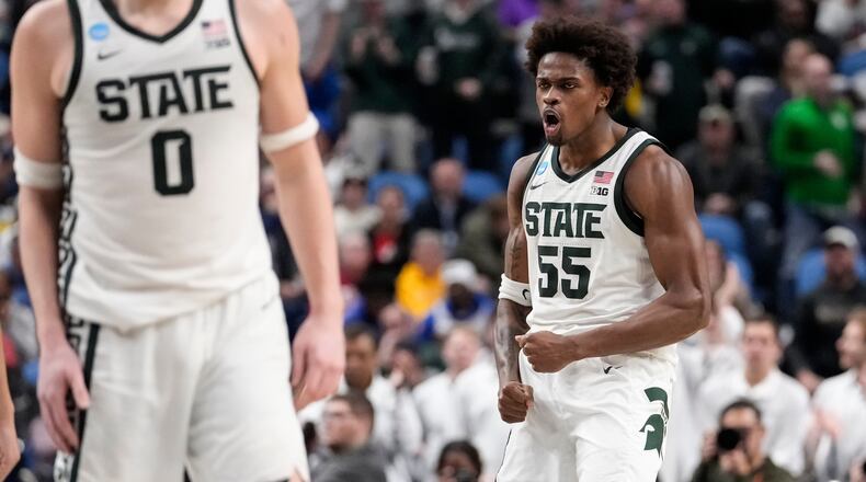 Michigan State forward Coen Carr (55) reacts after dunking against Louisville during the second half in the second round of the NCAA college basketball tournament, Saturday, March 21, 2026, in Buffalo, N.Y. (AP Photo/Yuki Iwamura)