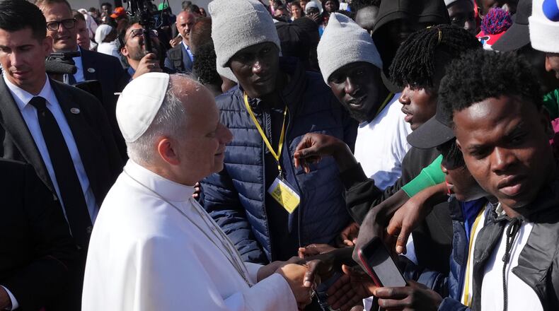 Pope Leo XIV meets migrants at the 'Las Raices' center, in San Cristobal de la Laguna, Tenerife, Spain, Friday, June 12, 2026. (AP Photo/Alessandra Tarantino)