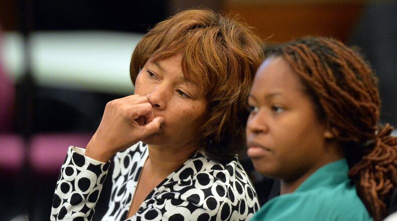 Former Dunbar Elementary School teachers Pamela Cleveland (left) and Shani Robinson listen as former Dunbar Elementary testing coordinator Lera Middlebrooks testifies for a second day in the Atlanta Public Schools test-cheating trial. Middlebrooks’ testimony under cross-examination focused on three defendants who taught at Dunbar: Cleveland, Robinson and Diane Buckner-Webb. (Kent D. Johnson, Atlanta Journal-Constitution)