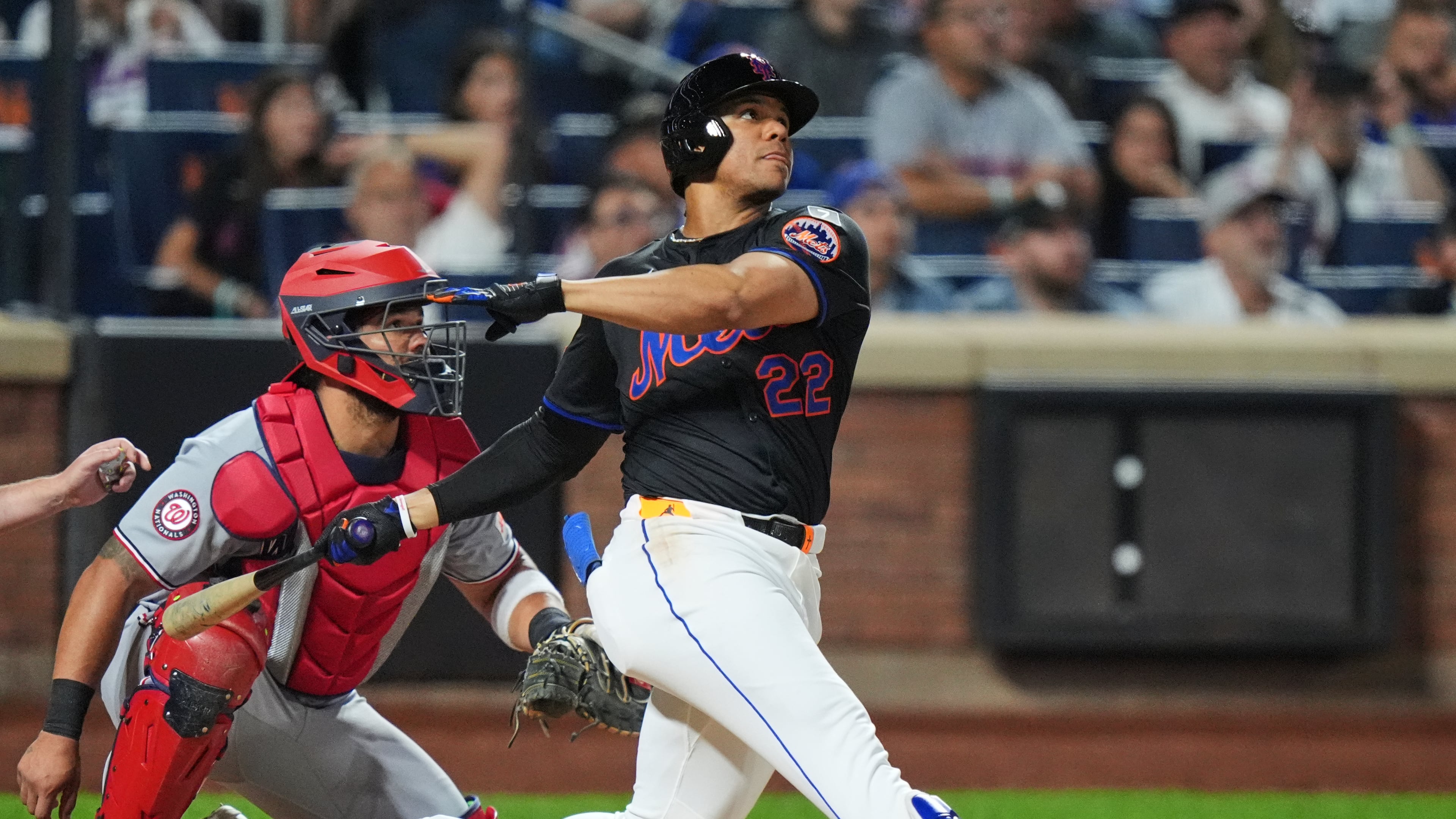Washington Nationals catcher Jorge Alfaro, left, watches as New York Mets' Juan Soto hits a three-run home run during the fourth inning of a baseball game Friday, Sept. 19, 2025, in New York. (AP Photo/Frank Franklin II)