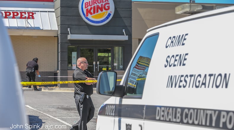 A man stumbled out of a Burger King on Memorial Drive after being shot inside by an acquaintance, police said. JOHN SPINK / JSPINK@AJC.COM