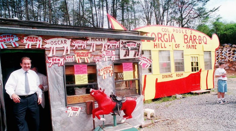 In an undated photo, former presidential hopeful Patrick Buchanan leaves Poole s Bar-B-Q in East Ellijay. / AJC file photo
