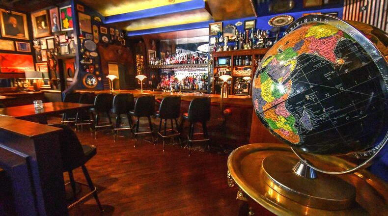 200630 Atlanta, Ga: One item that is consistent in the decoration of The Consulate is the globe as they occasionally allow a lucky patron to close their eyes and stop the globe and putting their finger on the next country's cuisine for the next menu. The Consulate restaurant in midtown Atlanta, Ga. Owner, Douglas Hines, who purchased items and decorated much of the space himself, wanted an open inviting floorplan "but not a mess hall" with many different spaces for patrons to move about in. As the restaurant is open mainly in evening hours it's decorated with muted outside light in mind. Living & Arts Sunday Living cover story on black-owned restaurants in the metro Atlanta area and the recent challenges they have had to overcome, including navigating their business during the coronavirus pandemic as well as during protest and calls to action against racial injustice. These operators also share their thoughts about the path forward. (CONTRIBUTED BY CHRIS HUNT PHOTOGRAPHY)