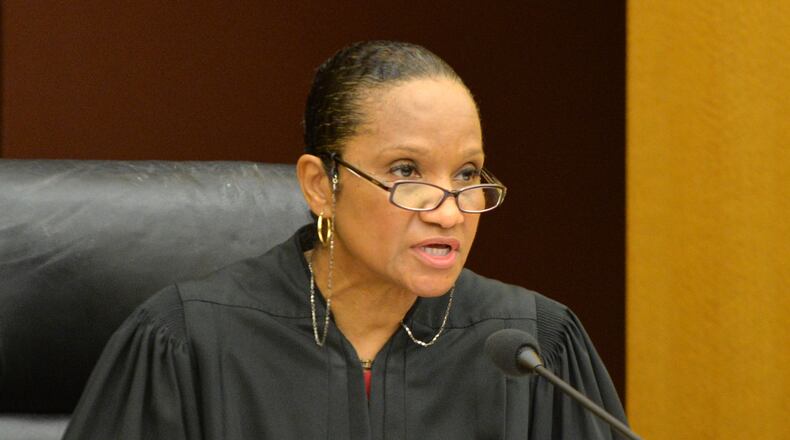 Judge Karen Smith Woodson, seen in this Sept. 30, 2014, file photo, was carjacked at gunpoint Sun., July 5, 2015. HYOSUB SHIN / HSHIN@AJC.COM