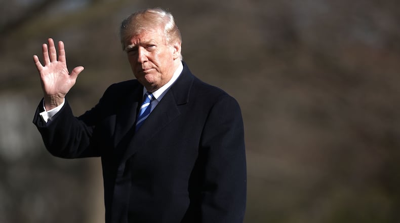 WASHINGTON, DC - APRIL 05: U.S. President Donald Trump waves to journalists after returning to the White House April 5, 2018 in Washington, DC.