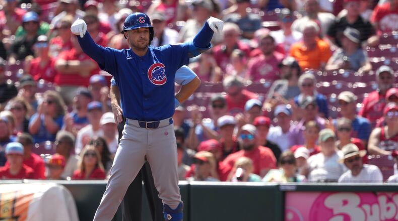 Chicago Cubs' Alex Bregman celebrates after a one-run single during the first inning of a baseball game against the Cincinnati Reds, Sunday, Sept. 20, 2026, in Cincinnati. (AP Photo/Kareem Elgazzar)