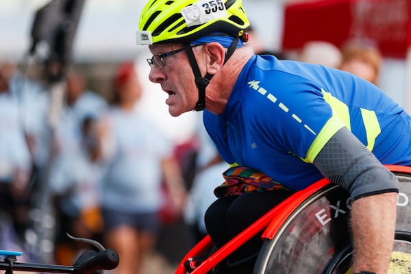 A competitor in the Shepherd Center wheelchair division race competes at "Hope Hill" during the 56th Peachtree Road Race. (Abbey Cutrer/AJC 2025)