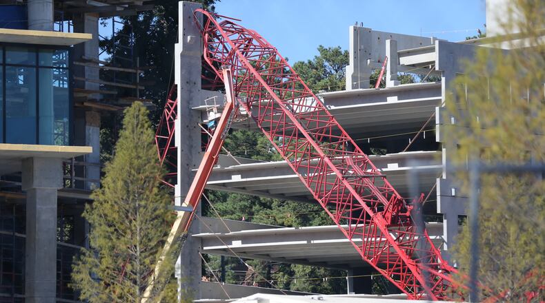 A crane fell at a construction site on Roxboro and Kingsboro roads. (Ben Gray / bgray@ajc.com)