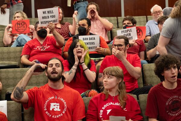 Data center opponents jeer after the Marietta City Council meeting adjourned Wednesday, June 10, 2026. (Ben Gray for the AJC)