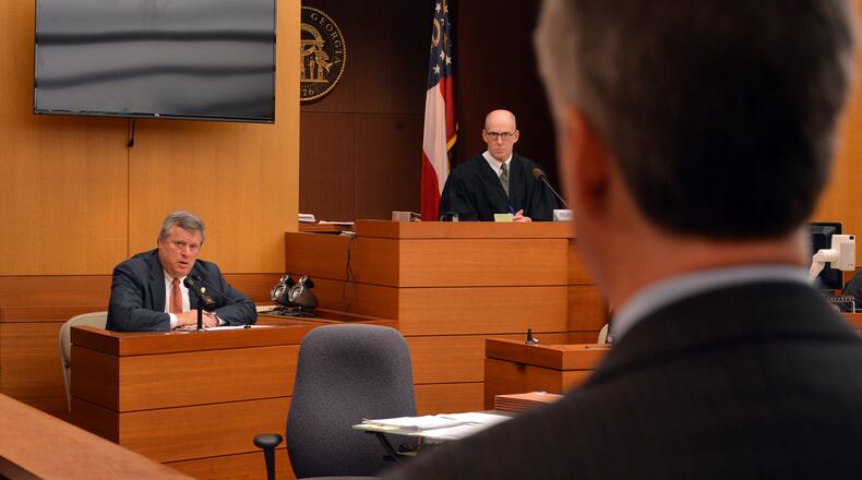 December 18, 2013 Atlanta: Sen. Don Balfour, R-Snellville listens to a question from his attorney Ken Hodges, foreground, Wednesday December 18, 2013. Judge Henry Newkirk, right, is presiding over the case. Balfour is charged with filing false expense claims and theft. Balfour has said he made mistakes on his expense reports but did nothing wrong intentionally. BRANT SANDERLIN /BSANDERLIN@AJC.COM