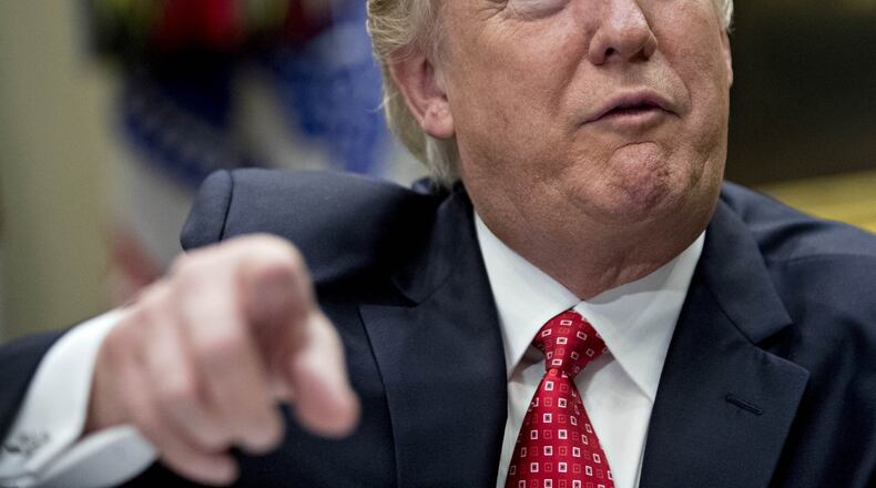 President Donald Trump on Monday signed a revised travel ban that has broad implications for the Atlanta area. Photo by Andrew Harrer - Pool/Getty Images. February 7, 2017 in Washington, DC.