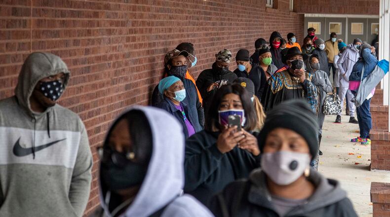Fulton County residents wait in line in 2020 to cast ballots during early voting at the C.T. Martin Natatorium and Recreation Center near the Westhaven neighborhood in Atlanta. (Alyssa Pointer/The Atlanta Journal-Constitution)