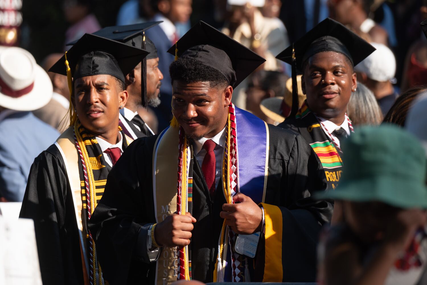 A student poses for a photo before the Morehouse College graduation Sunday, May 17, 2026. (Ben Gray for the AJC)