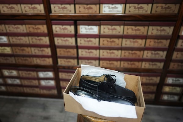 A pair of shoes like the ones regularly worn by Jorge Bergoglio are displayed at Muglia shoe store in the Flores neighborhood where the late Pope Francis grew up in Buenos Aires, Argentina, Thursday, April 24, 2025. (AP Photo/Natacha Pisarenko)
