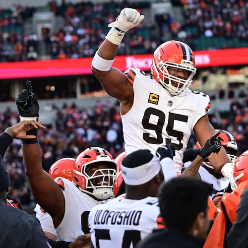 FILE - Cleveland Browns defensive end Myles Garrett, center, celebrates with teammates after breaking the NFL single season sack record during the second half of an NFL football game against the Cincinnati Bengals in Cincinnati, Jan. 4, 2026. (AP Photo/David Dermer, File)