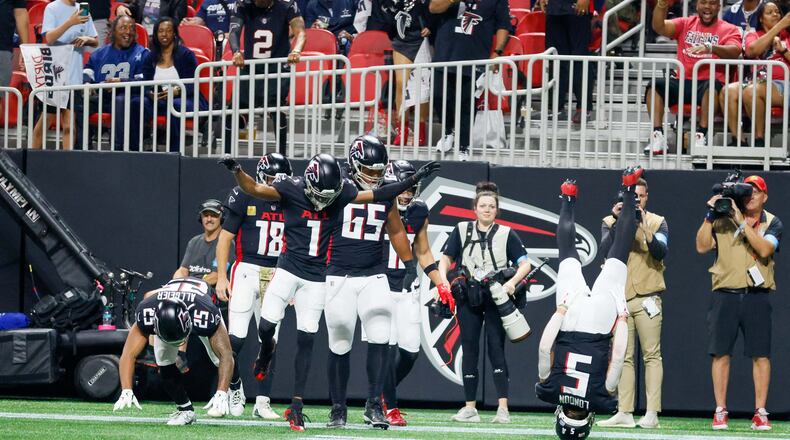 Atlanta Falcons wide receiver Drake London (5) celebrates with teammates after scoring a touchdown during the first half of an NFL football game against the Dallas Cowboys on Sunday, November 3, 2024, at Mercedes-Benz Stadium in Atlanta.
(Miguel Martinez/ AJC)